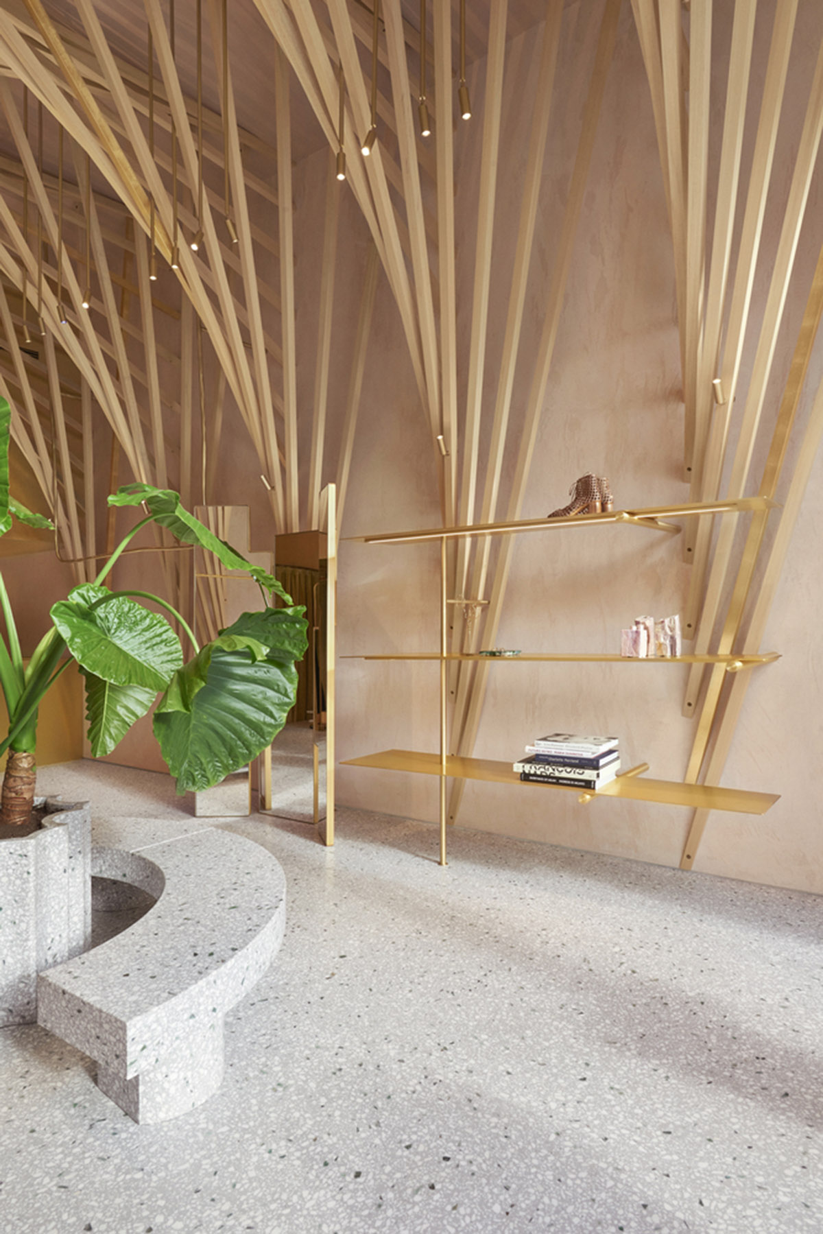 Golden and powder-colored details dominate forte_forte forte dei Marmi boutique in Italy