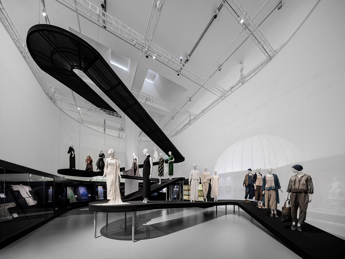 Studio 10 designs exhibition space with white tubular structures and black translucent ramps in China