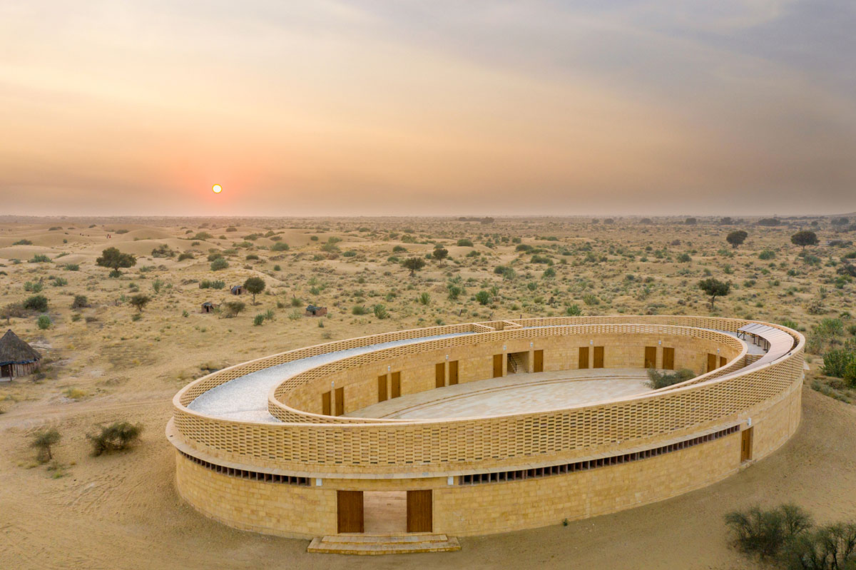Diana Kellogg Architects' oval-shaped girl's school is made of hand-carved sandstone in rural India