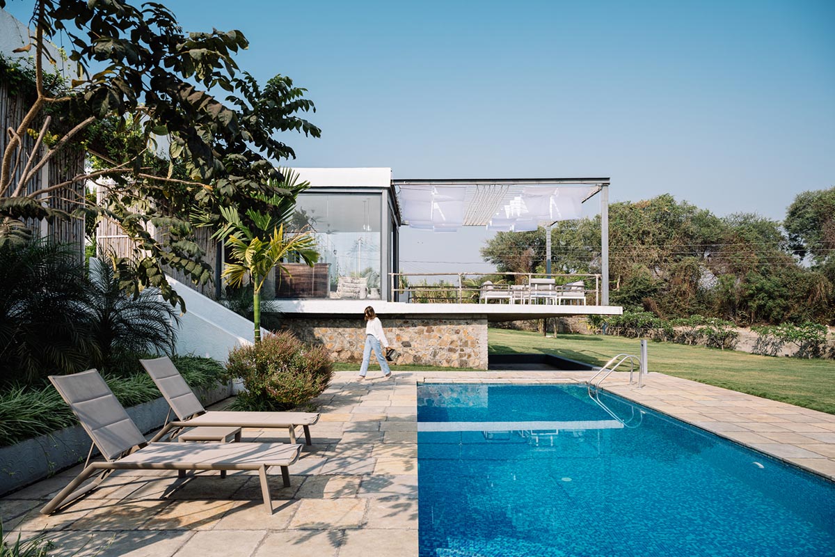 Weekend home is clad in bamboo screens that create a rustic appearance on the outskirts of Pune