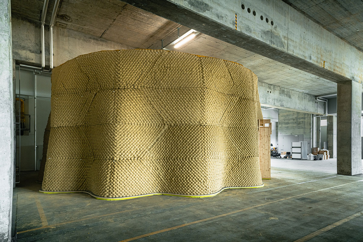 Gramazio Kohler Research used 30,000 soft clay bricks to install undulating clay rotunda in Bern