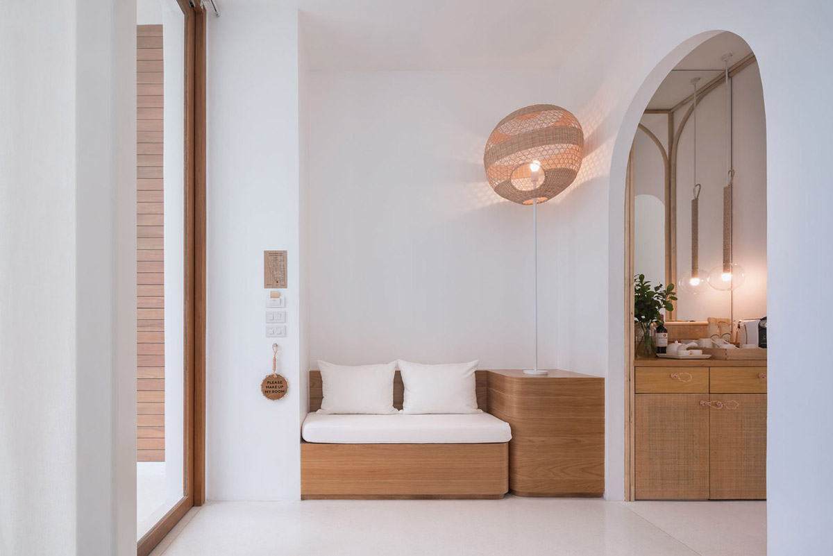 onion combines white concave and convex walls with colorful surfaces for beach resort in Thailand