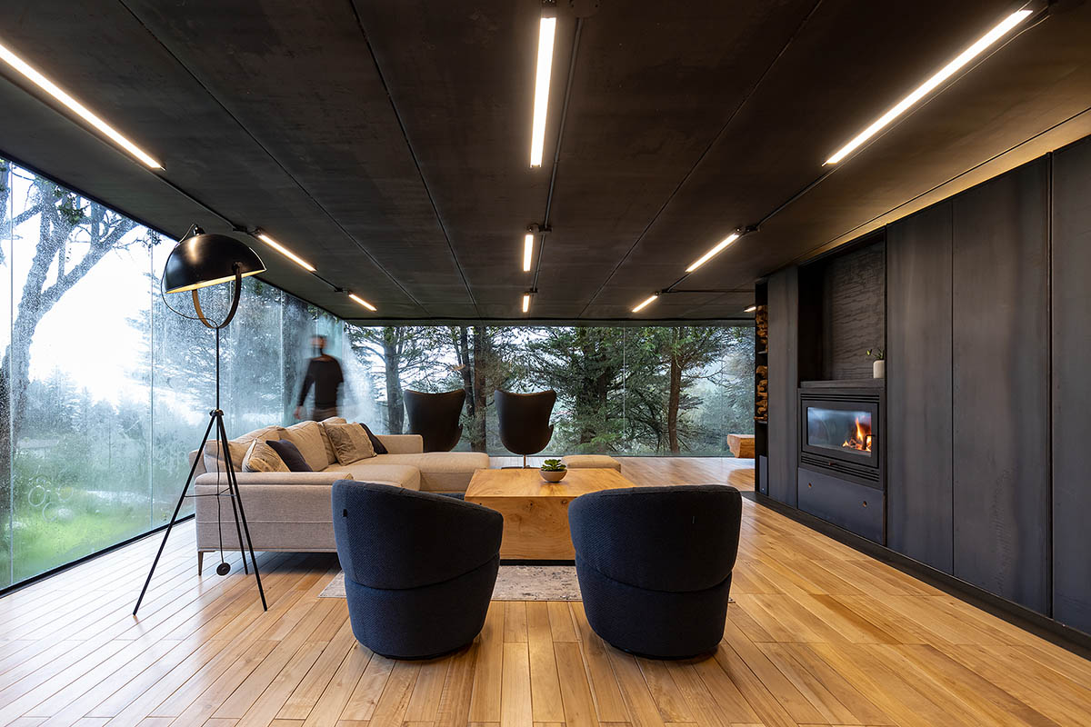 RAMA estudio built glazed retreat that sits on slope with minimal touch overlooking valley in Ecuador