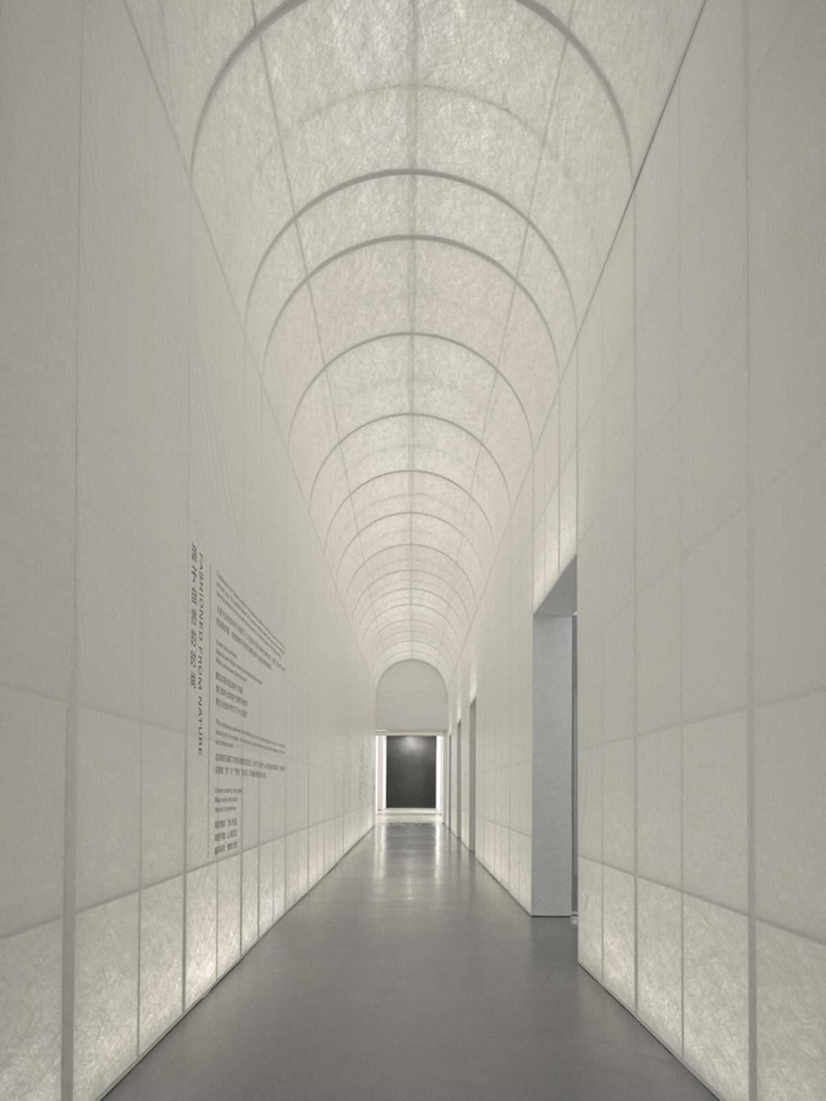 Studio 10 designs exhibition space with white tubular structures and black translucent ramps in China