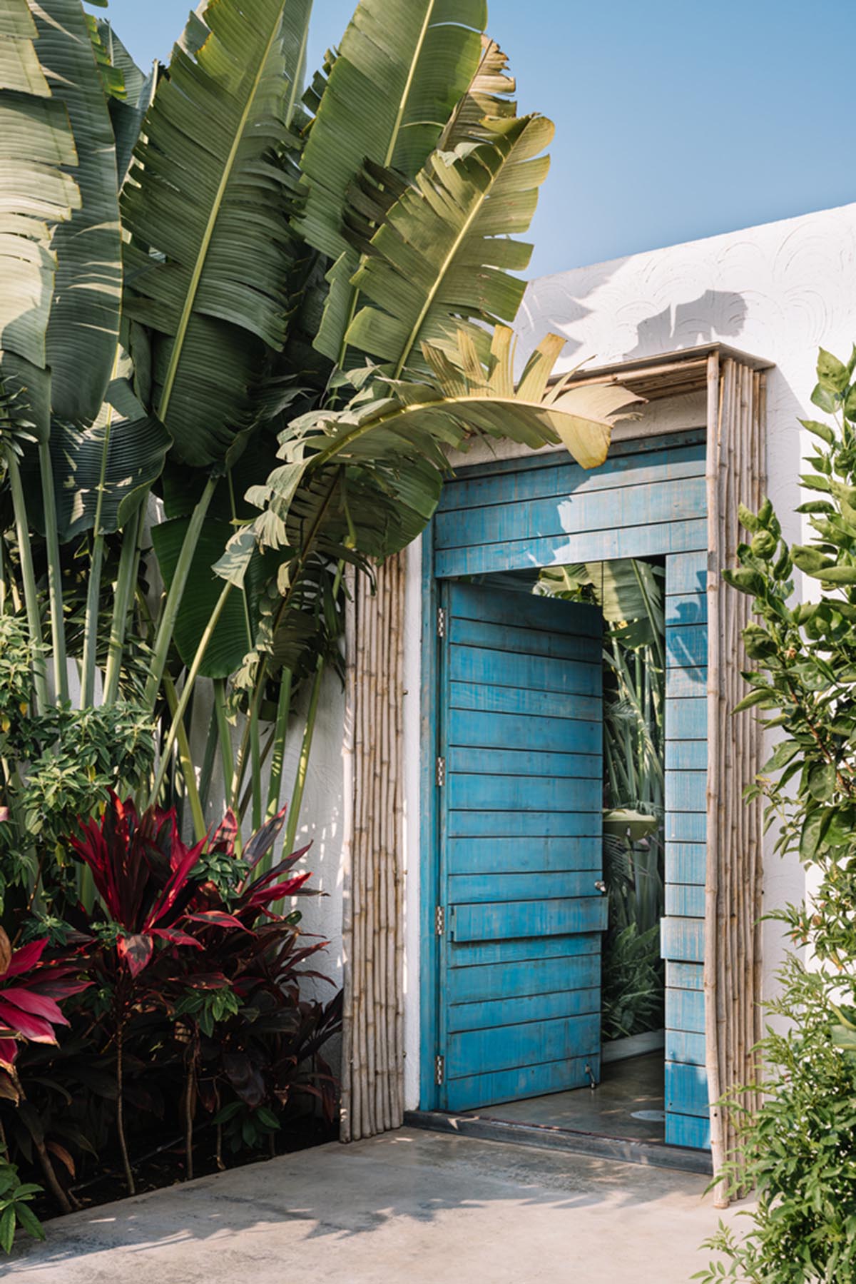 Weekend home is clad in bamboo screens that create a rustic appearance on the outskirts of Pune