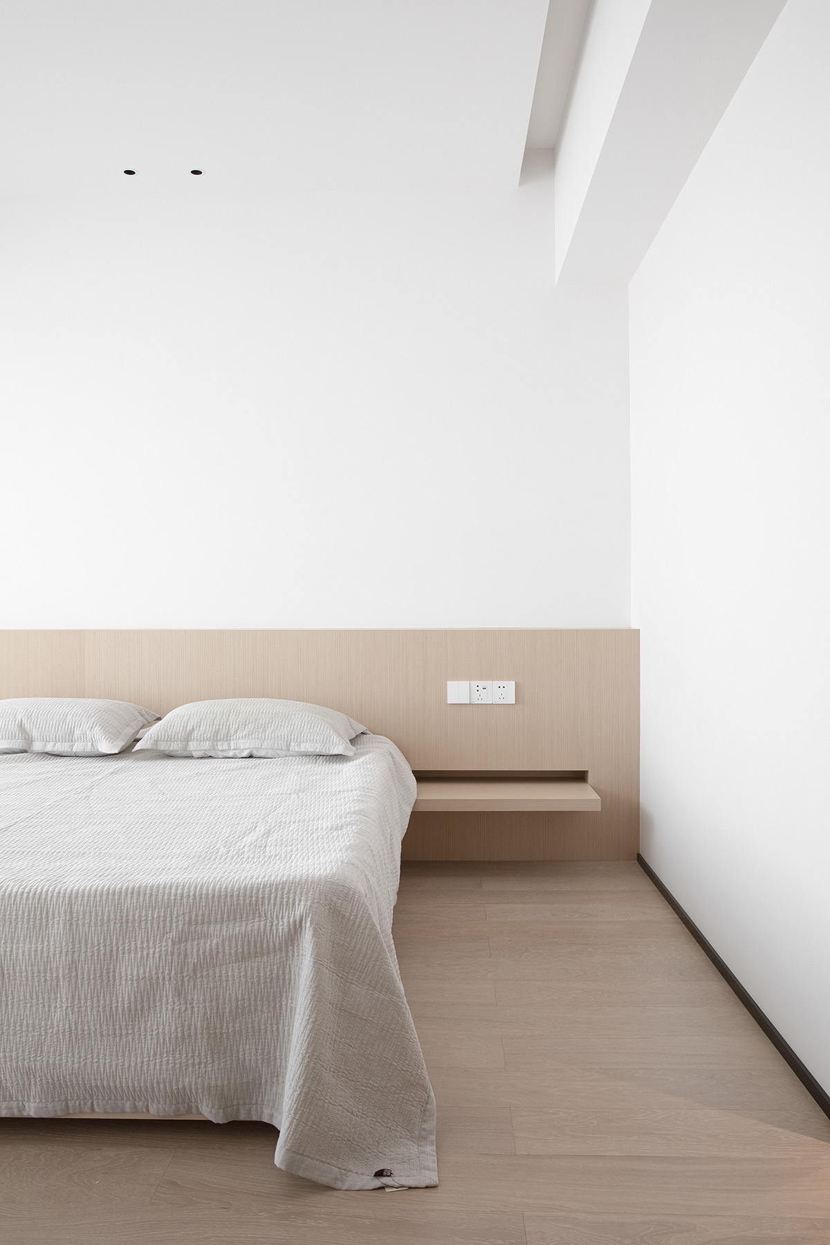 AD ARCHITECTURE creates all-white interiors with geometric compositions for L Apartment in China