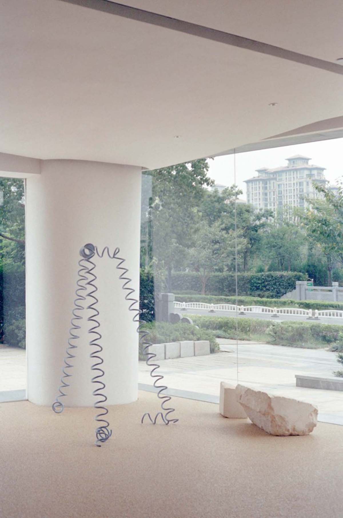 Cheese-like and stone tables with pinkish quirky-shaped elements add more personality to DSC store