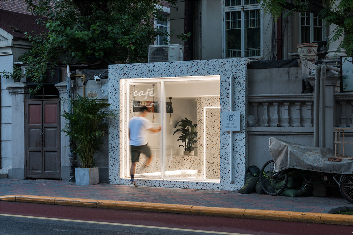 This tiny cafe by TOUCH Design is dotted with white and orange interwoven terrazzo details in Tianjin