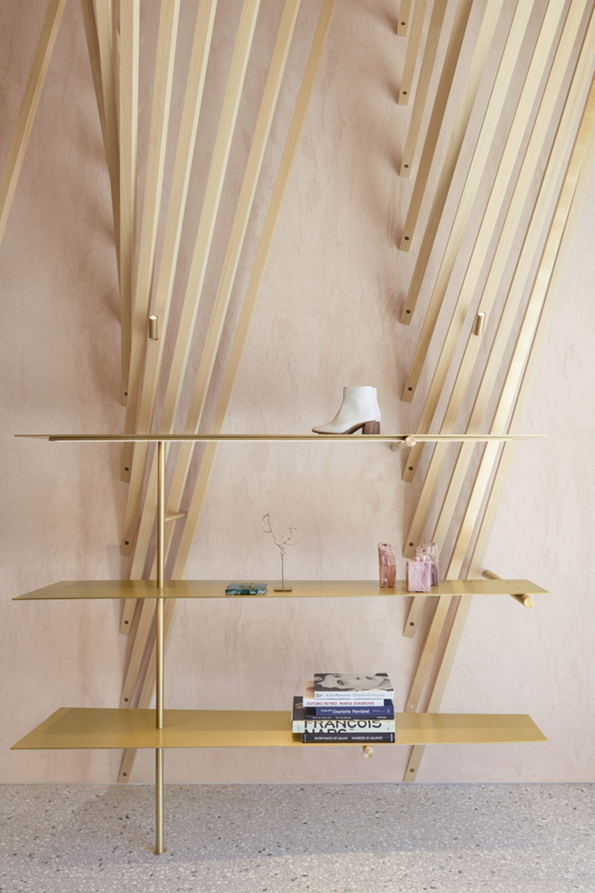 Golden and powder-colored details dominate forte_forte forte dei Marmi boutique in Italy