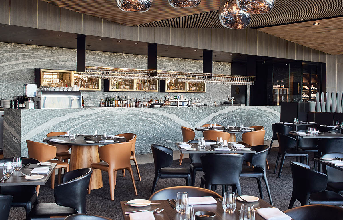 Wood Marsh completes sinuous resort anchored on hand-built locally sourced stone plinth in Australia