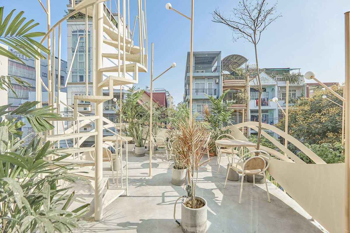 September Cafe is designed to look like a bird's nest with curved steel stripes in Vietnam