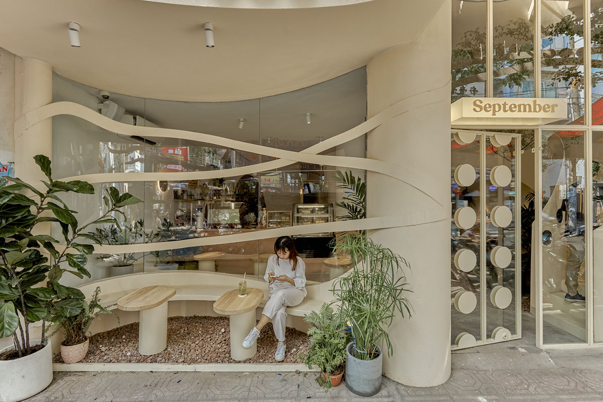 September Cafe is designed to look like a bird's nest with curved steel stripes in Vietnam