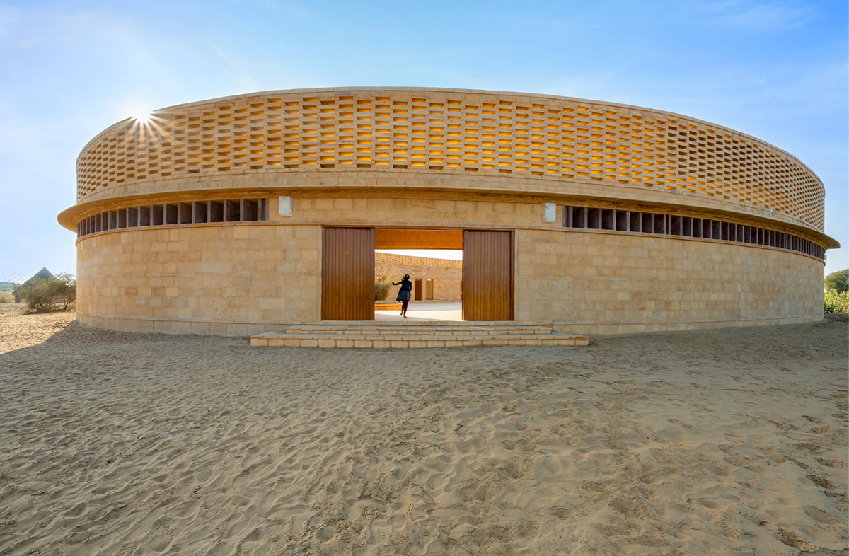 Diana Kellogg Architects' oval-shaped girl's school is made of hand-carved sandstone in rural India