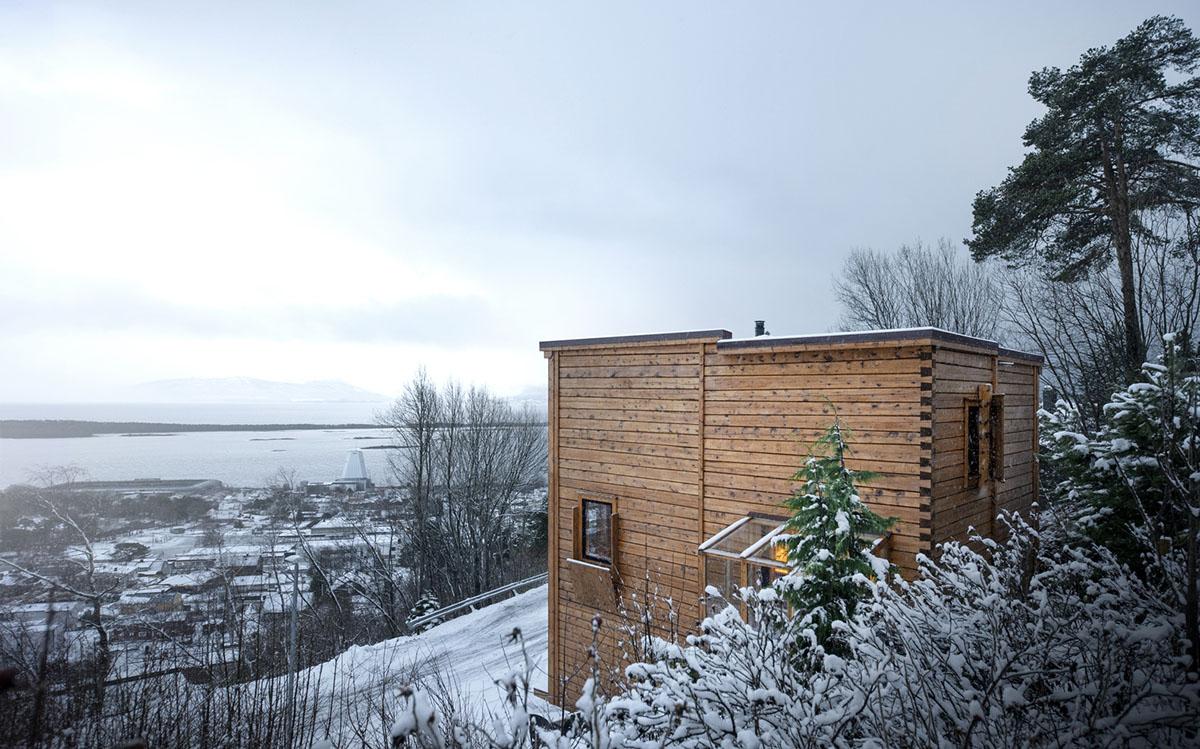 High windows allow users to get well-lit living spaces for this house by Rever & Drage Architects