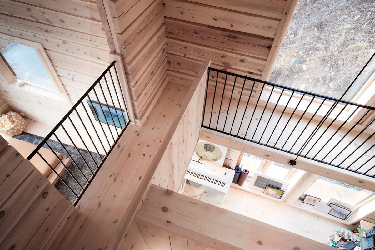 High windows allow users to get well-lit living spaces for this house by Rever & Drage Architects