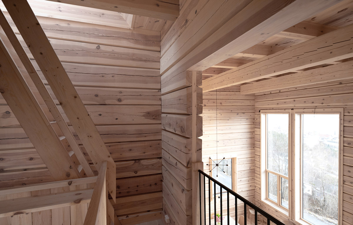 High windows allow users to get well-lit living spaces for this house by Rever & Drage Architects