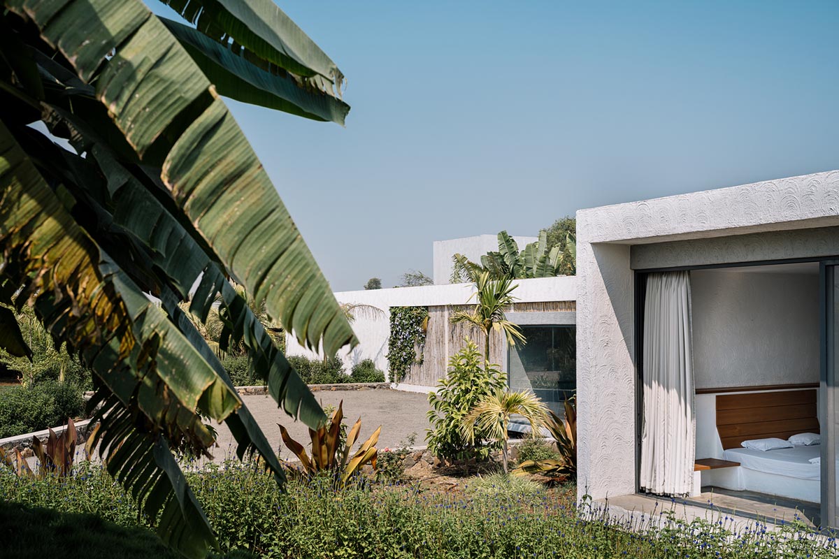 Weekend home is clad in bamboo screens that create a rustic appearance on the outskirts of Pune