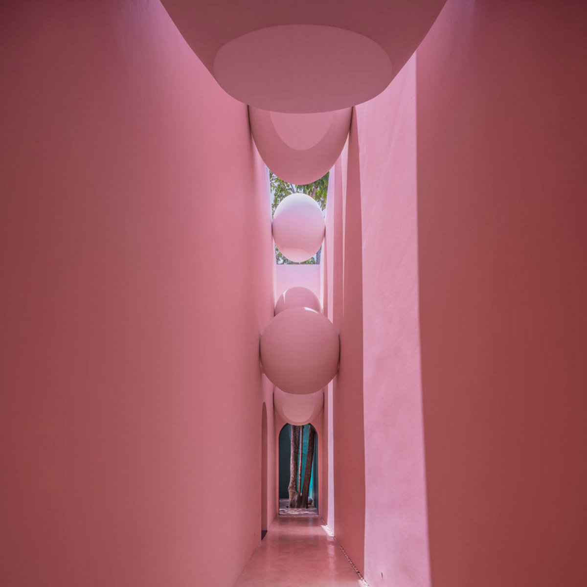 onion combines white concave and convex walls with colorful surfaces for beach resort in Thailand