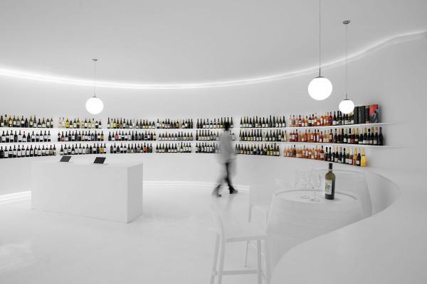 Porto Architects designs all-white interior for wine concept store in ...